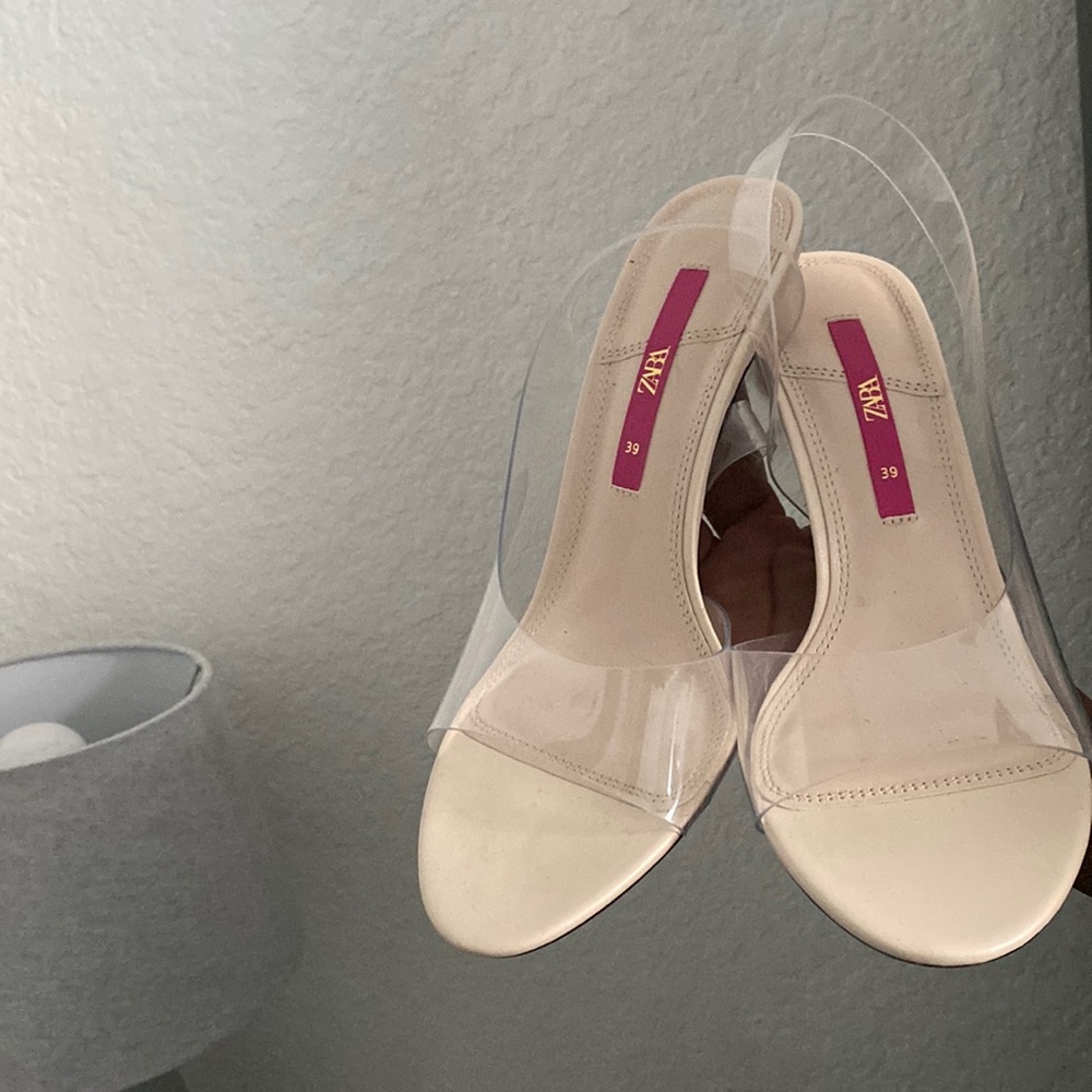 Clear nude heels indented in the middle